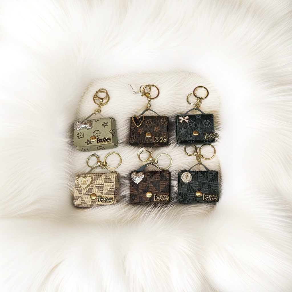 Six mini handbag keychains feature different patterns and decorative details details Picture