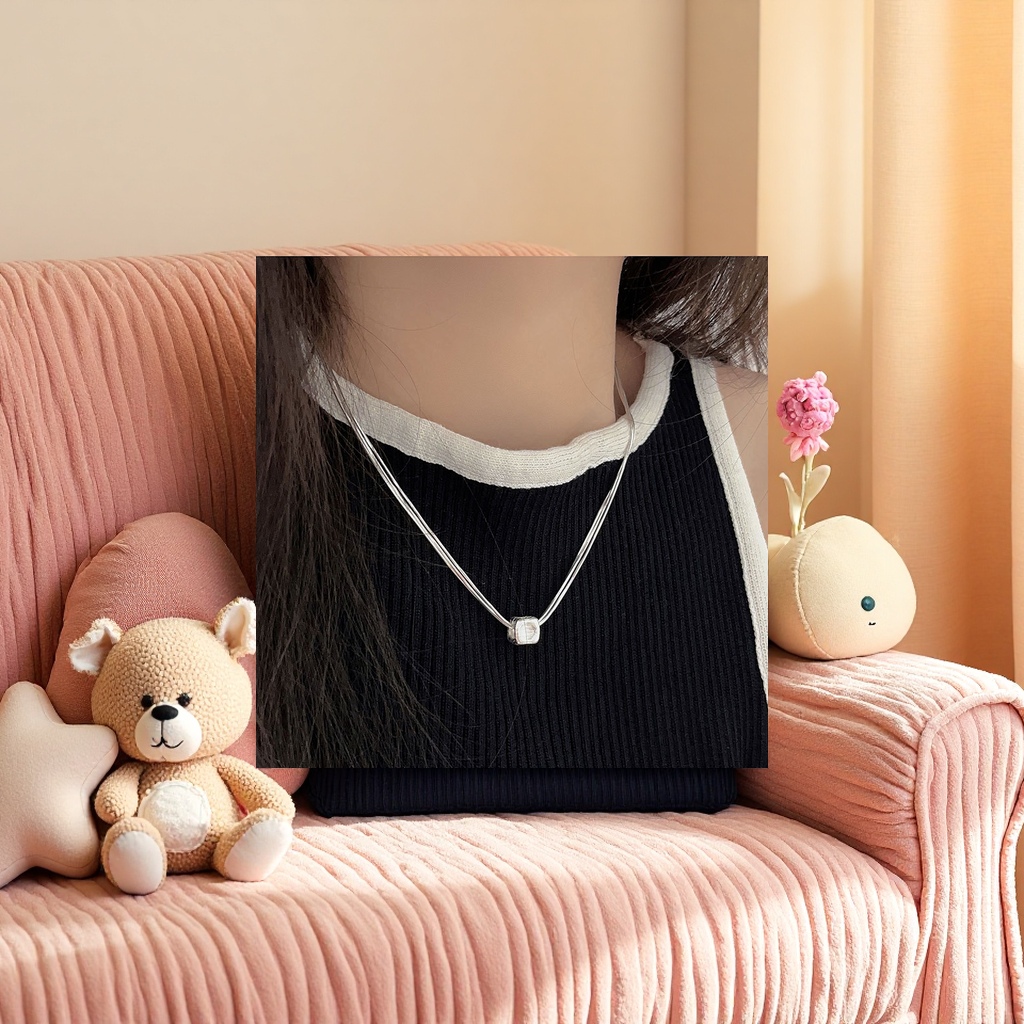 A silver multi-strand chain necklace with a square pendant Application Scenario