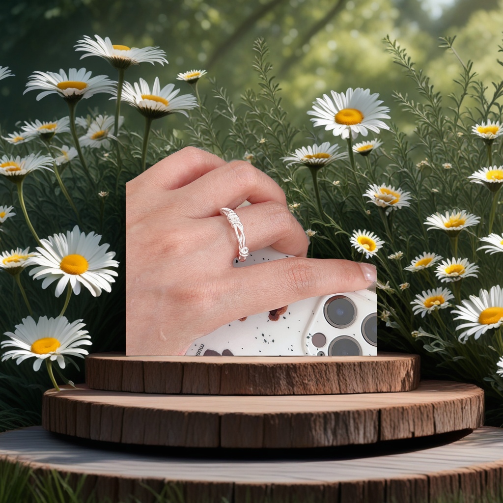 The silver twisted rope design ring is simple and fashionable to wear on the finger Specification image