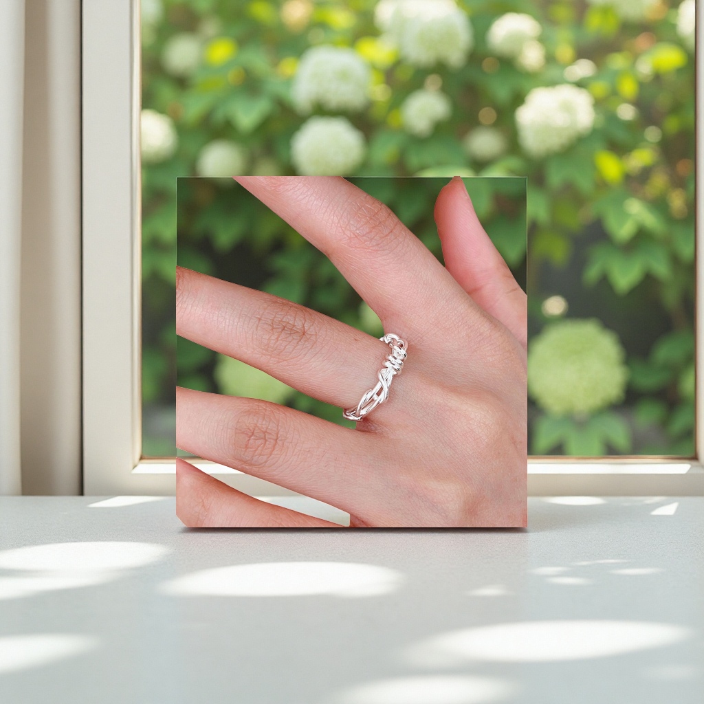 The silver twisted rope design ring is simple and fashionable to wear on the finger details Picture