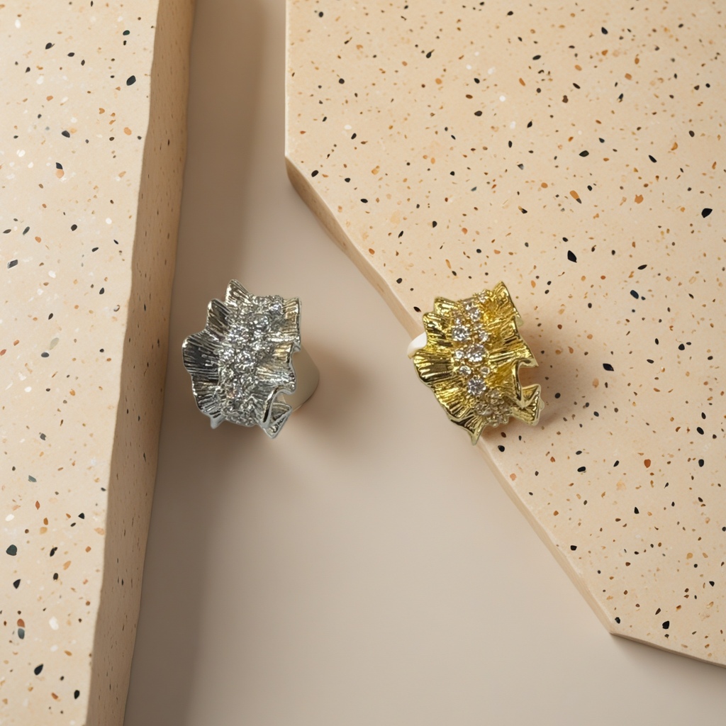 Gold and silver leaf-shaped diamond-encrusted stud earrings details Picture