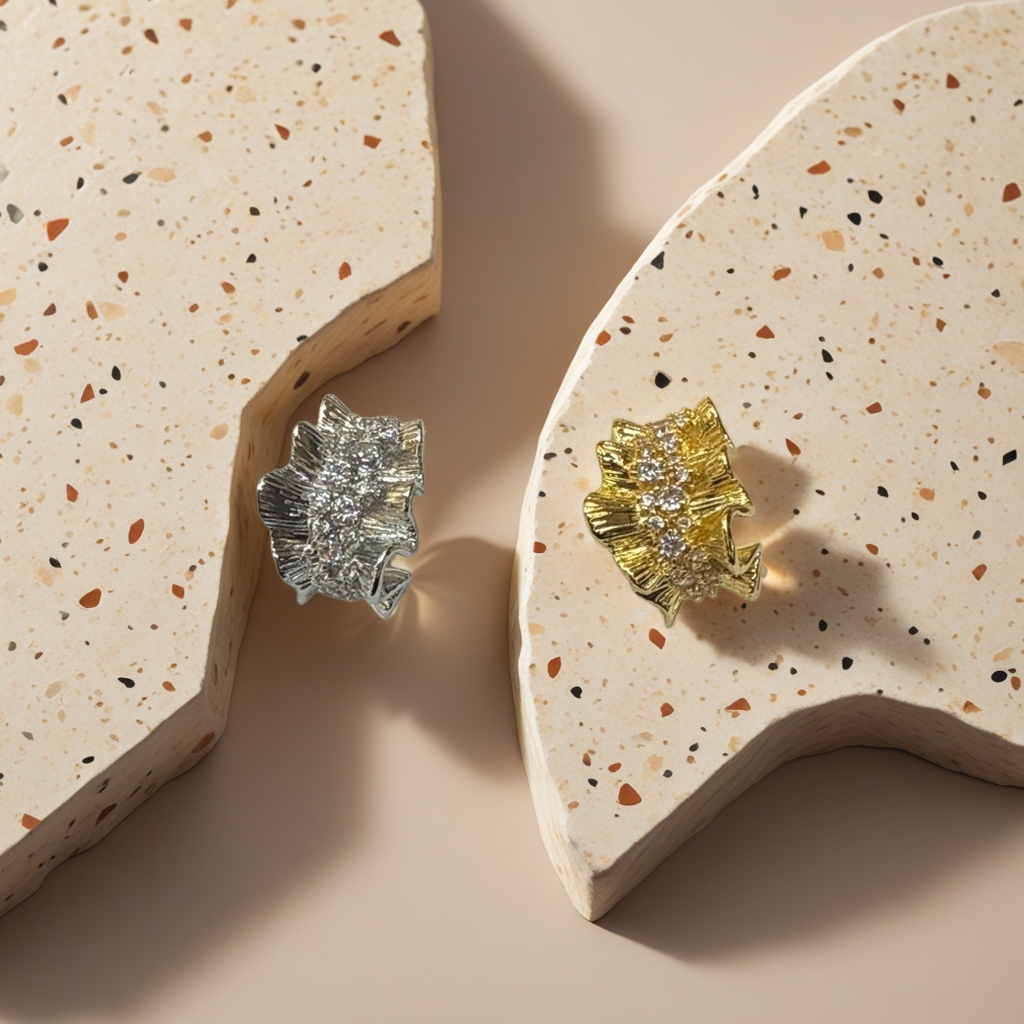 Gold and silver leaf-shaped diamond-encrusted stud earrings Gold and silver leaf-shaped diamond-encrusted stud earrings