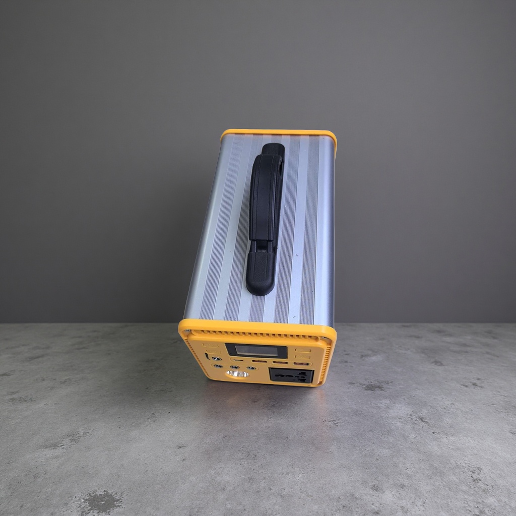 Portable power supply with silver striped shell and yellow frame details Picture