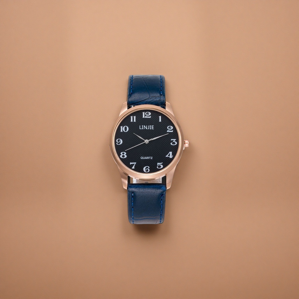 A ladies' watch with a blue leather strap, rose gold frame and black dial details Picture
