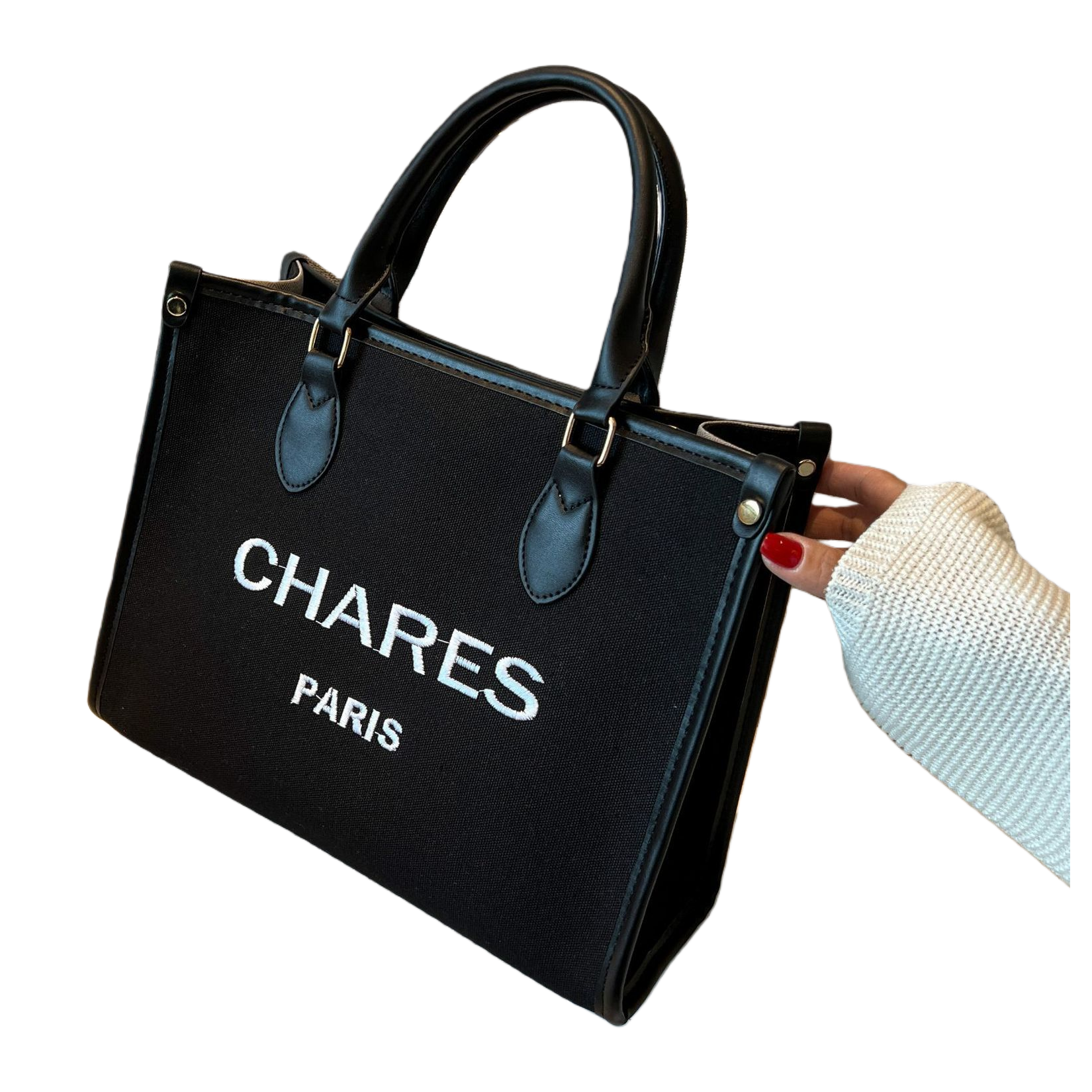 CHARES PARIS black handbag with white logo, black leather handle and beige sofa scene Item Picture