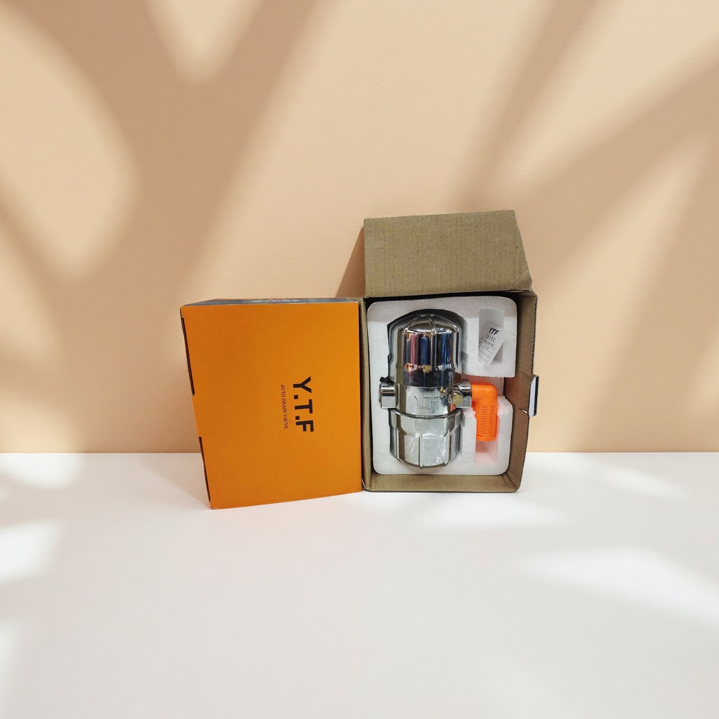 Silver metal automatic drain valve in orange packaging box Application Scenario