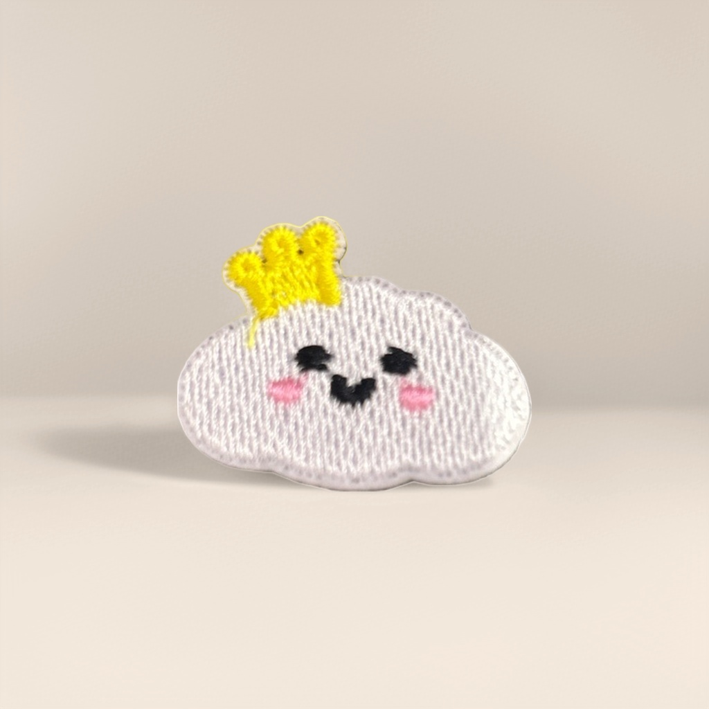Grey striped background, pink cloud embroidered patches, wearing a small yellow crown, with black eyes and a smiling mouth Specification image