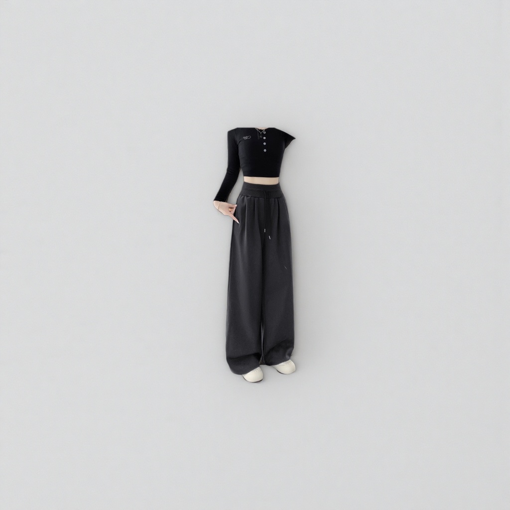 Dark grey long wide-leg pants paired with a black short top and white sports shoes details Picture