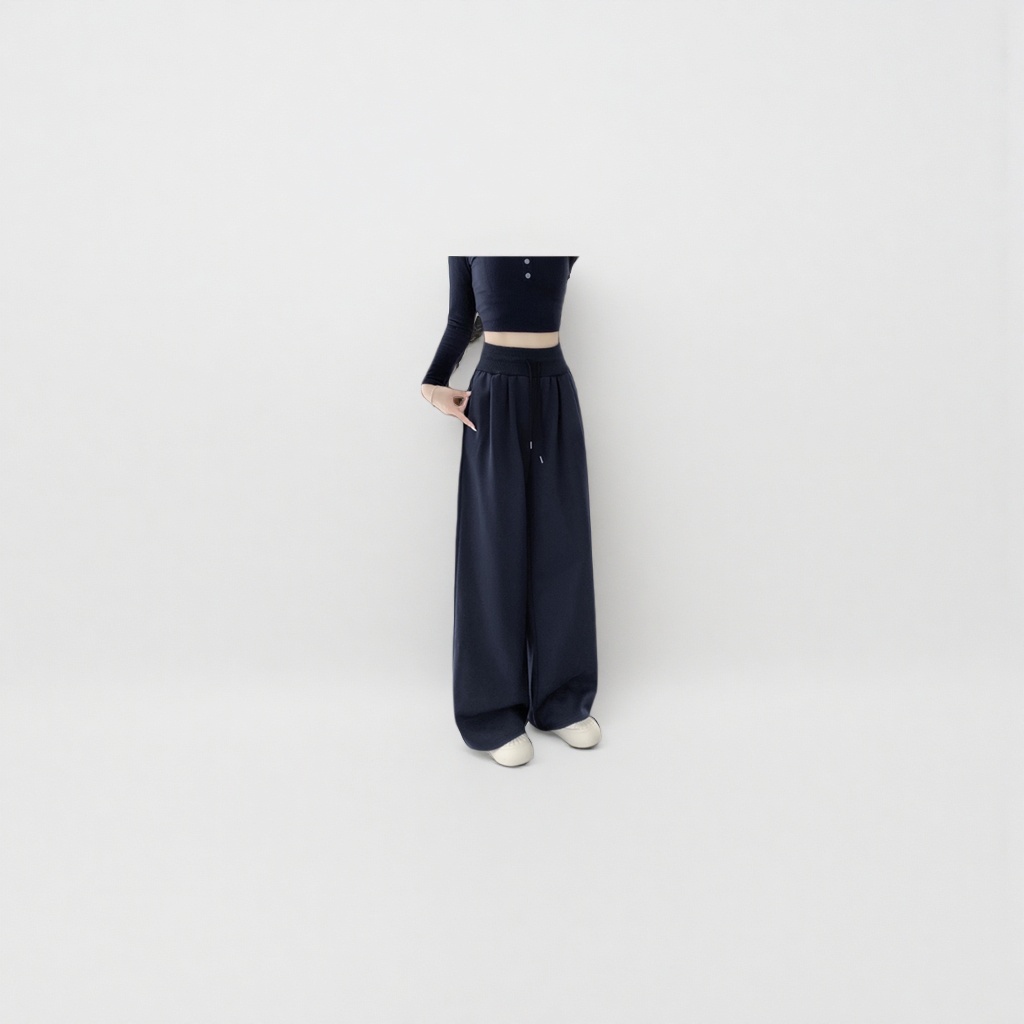 Navy blue high-waisted wide-leg pants for women paired with a black short top and white sports shoes Specification image