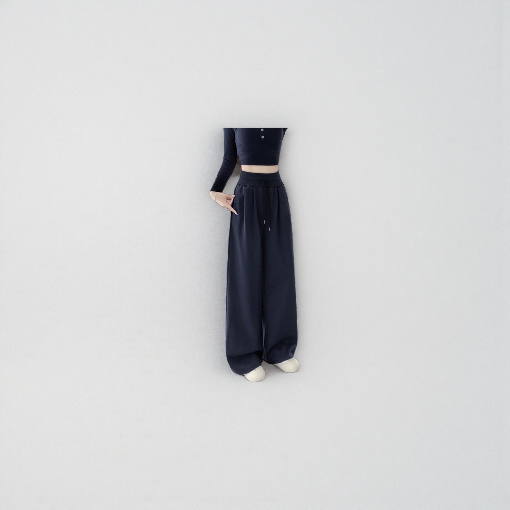 Navy blue high-waisted wide-leg pants for women paired with a black short top and white sports shoes details Picture