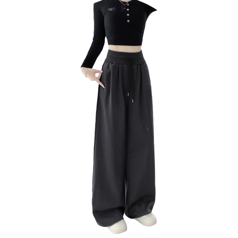 Dark grey long wide-leg pants paired with a black short top and white sports shoes Item Picture