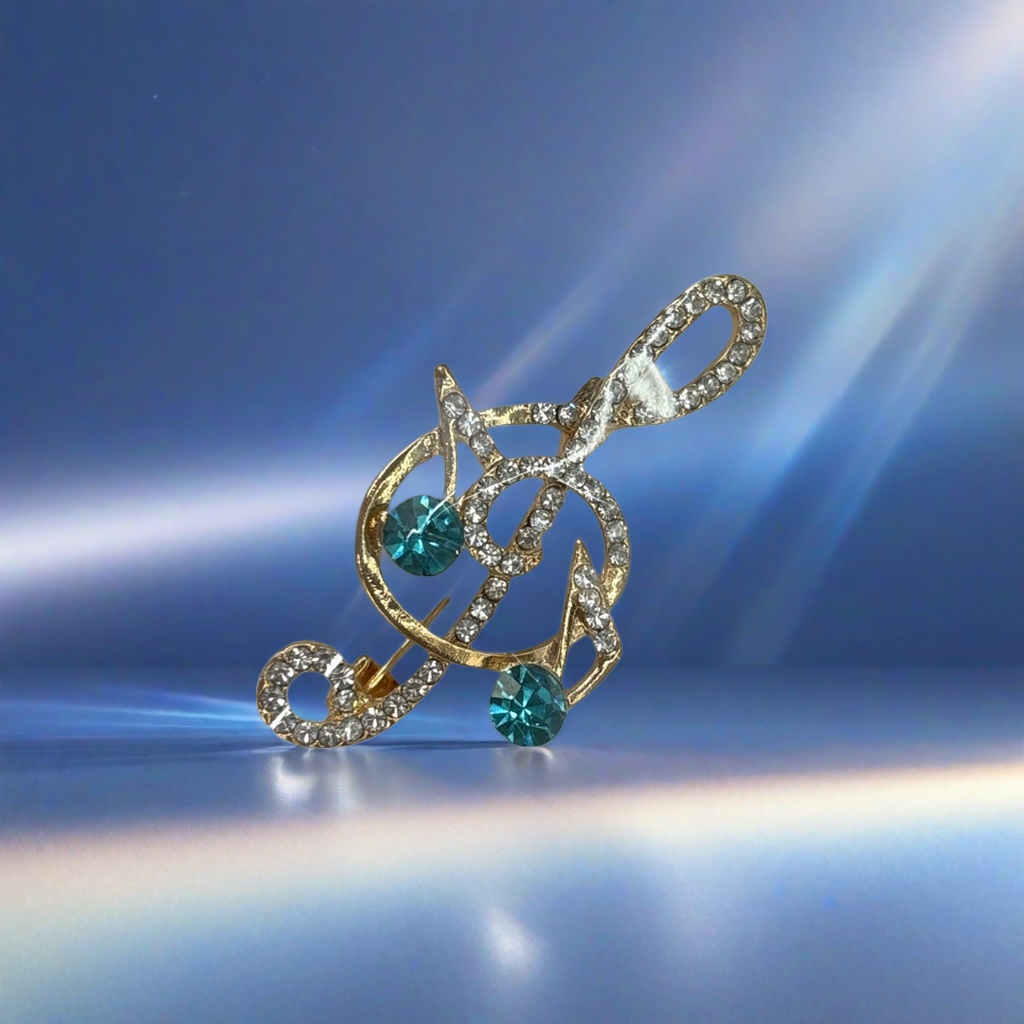 A golden note-shaped brooch set with blue and green transparent rhinestones and fashionable jewelry, wrapped in a white card Application Scenario