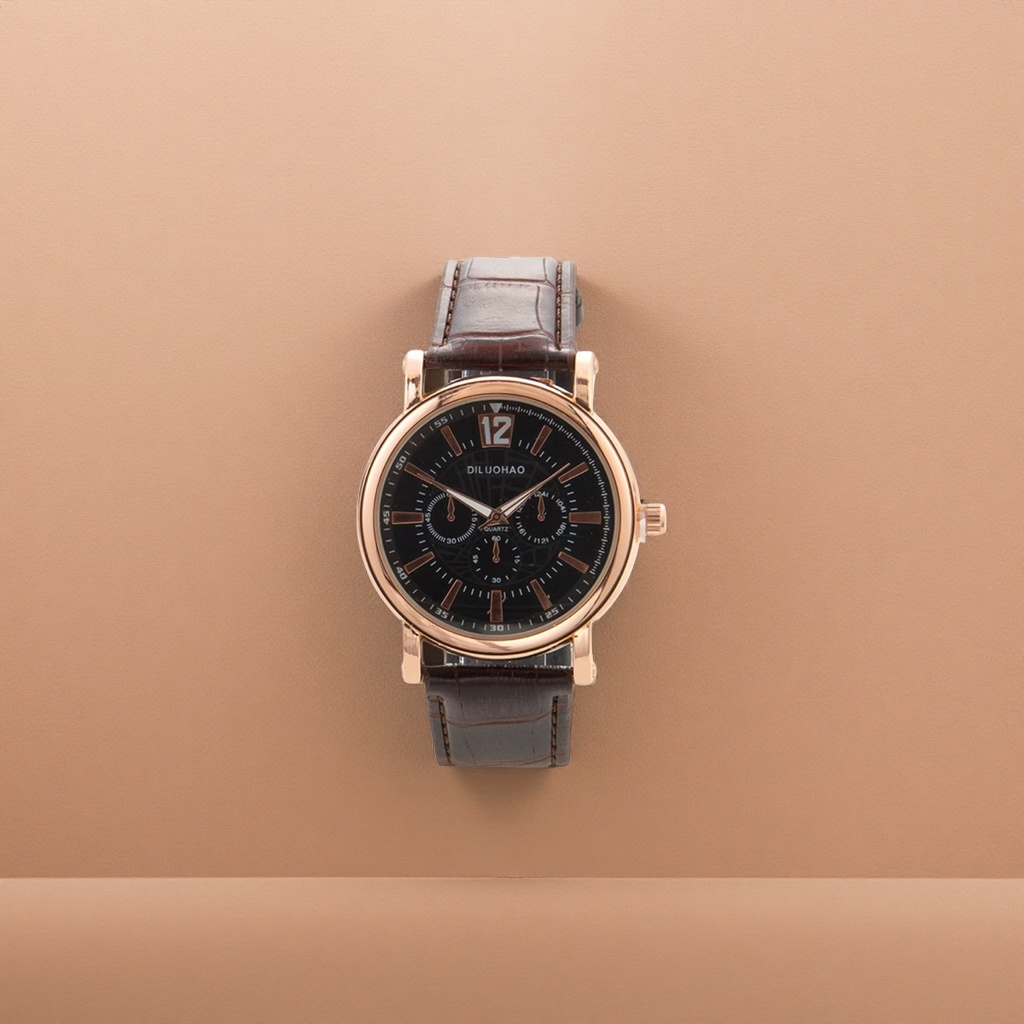 A rose gold case, black dial and brown leather strap watch