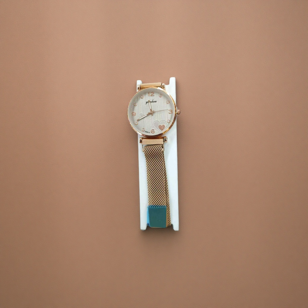 The watch features a golden case with white striped heart-shaped decoration and a metal mesh strap with a white stand Specification image