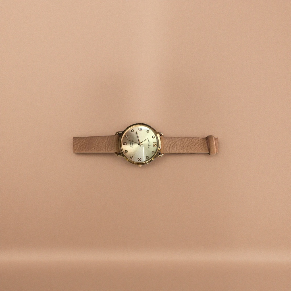 A simple and fashionable quartz watch for both men and women with a golden case and beige leather strap