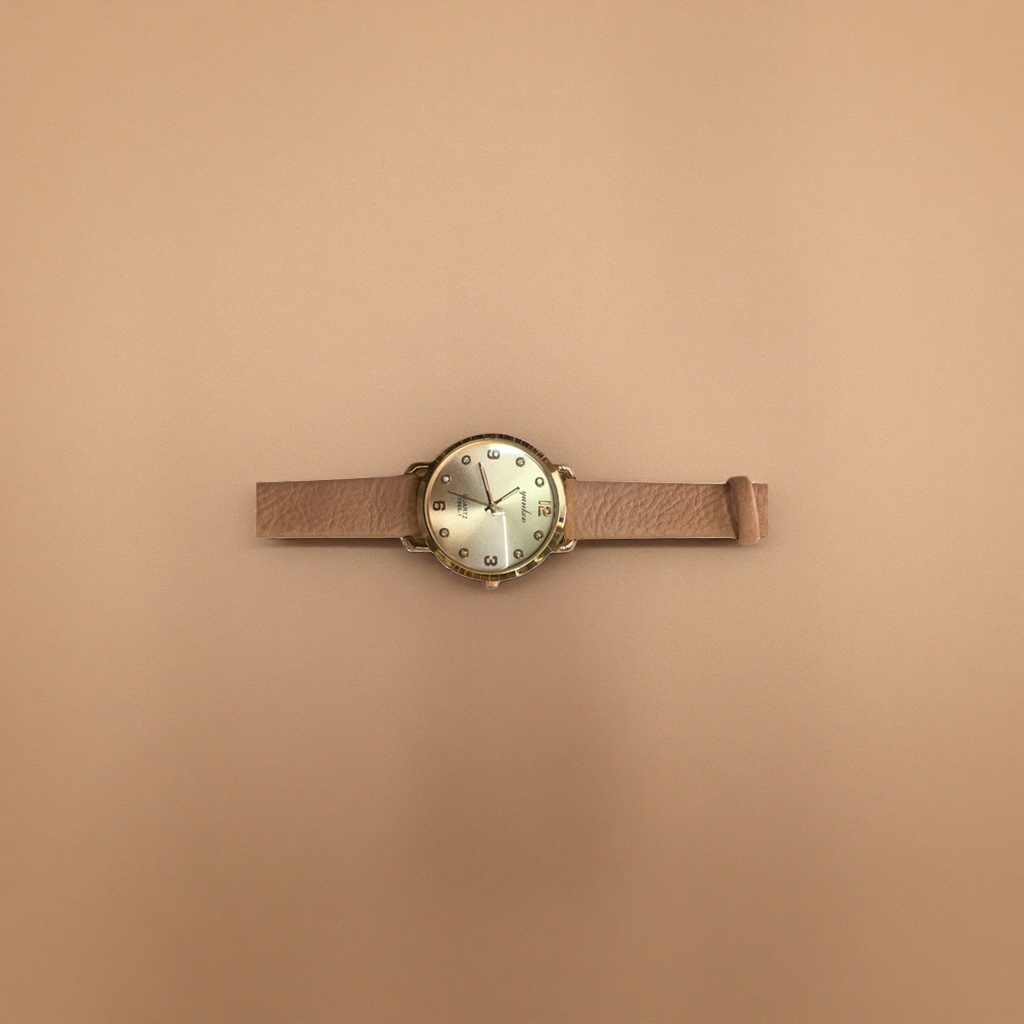 A simple and fashionable quartz watch for both men and women with a golden case and beige leather strap details Picture