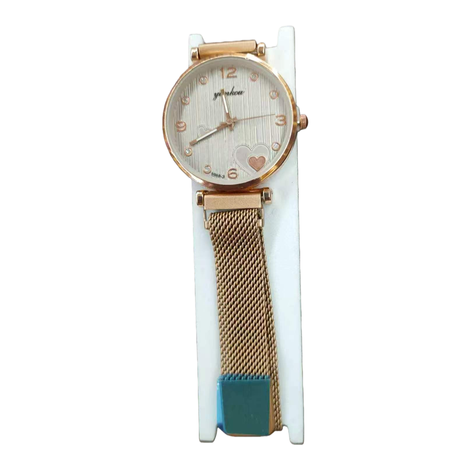 The watch features a golden case with white striped heart-shaped decoration and a metal mesh strap with a white stand Item Picture