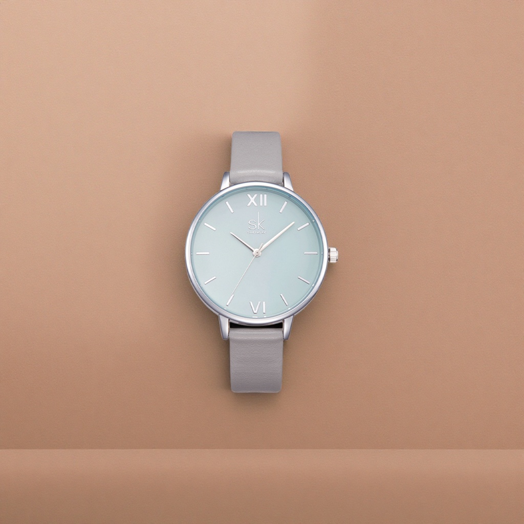 A men's quartz watch with a light blue dial, silver bezel and grey leather strap