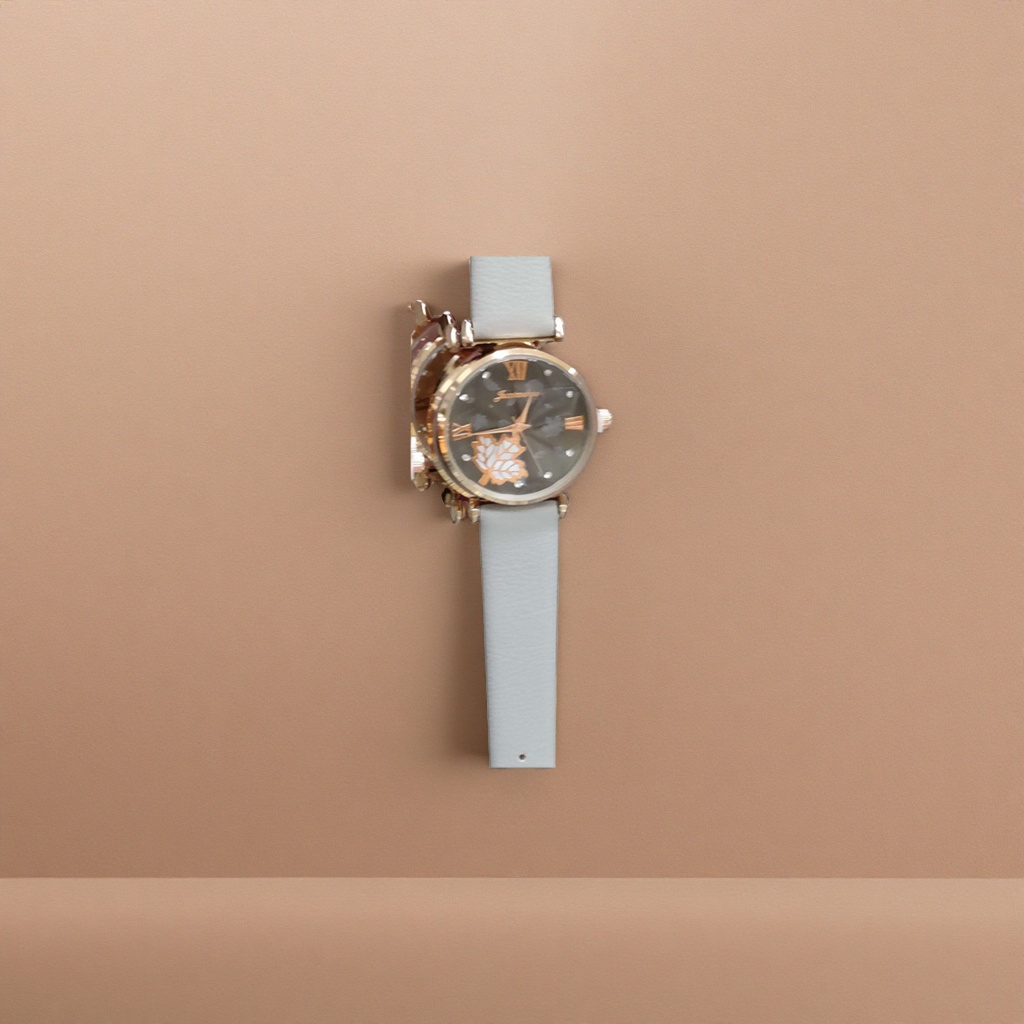 A simple and fashionable quartz watch with a golden case and a white strap