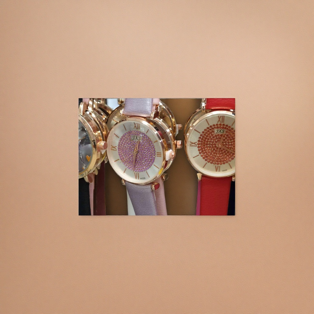 A ladies' watch with a golden case, purple strap and diamonds details Picture