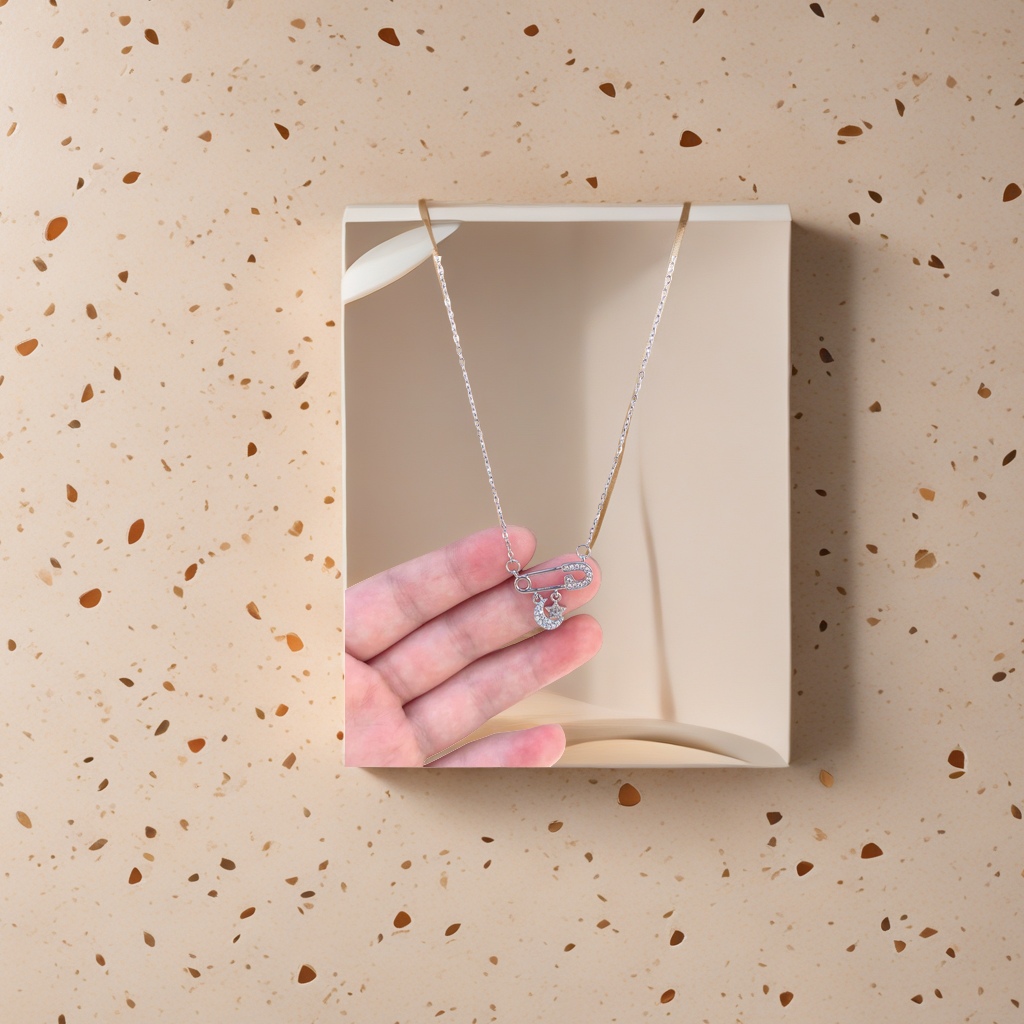 Silver safety pin necklace with diamond-encrusted moon and star pendant Application Scenario
