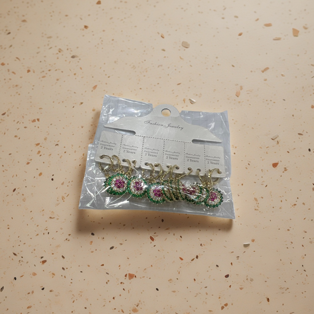 A set of golden, green and red diamond earrings is a fashionable and light luxury accessory for women details Picture