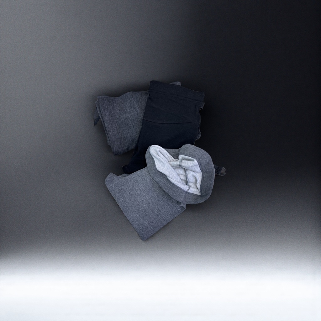 A grey hooded sweatshirt paired with black trousers is displayed on a wooden textured tabletop Application Scenario