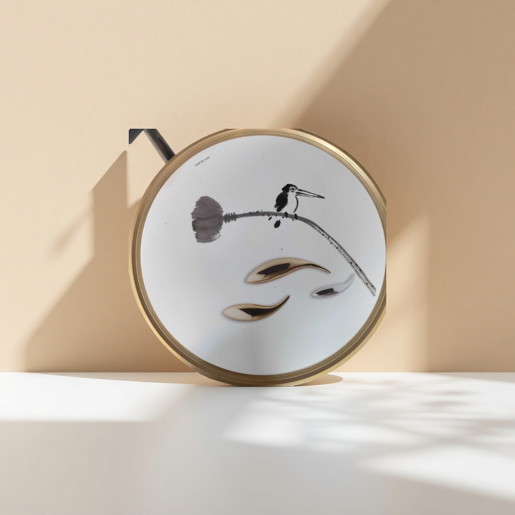 A white round tray with ink-wash birds perching on the branches is decorated with gold and silver metal spoons Application Scenario