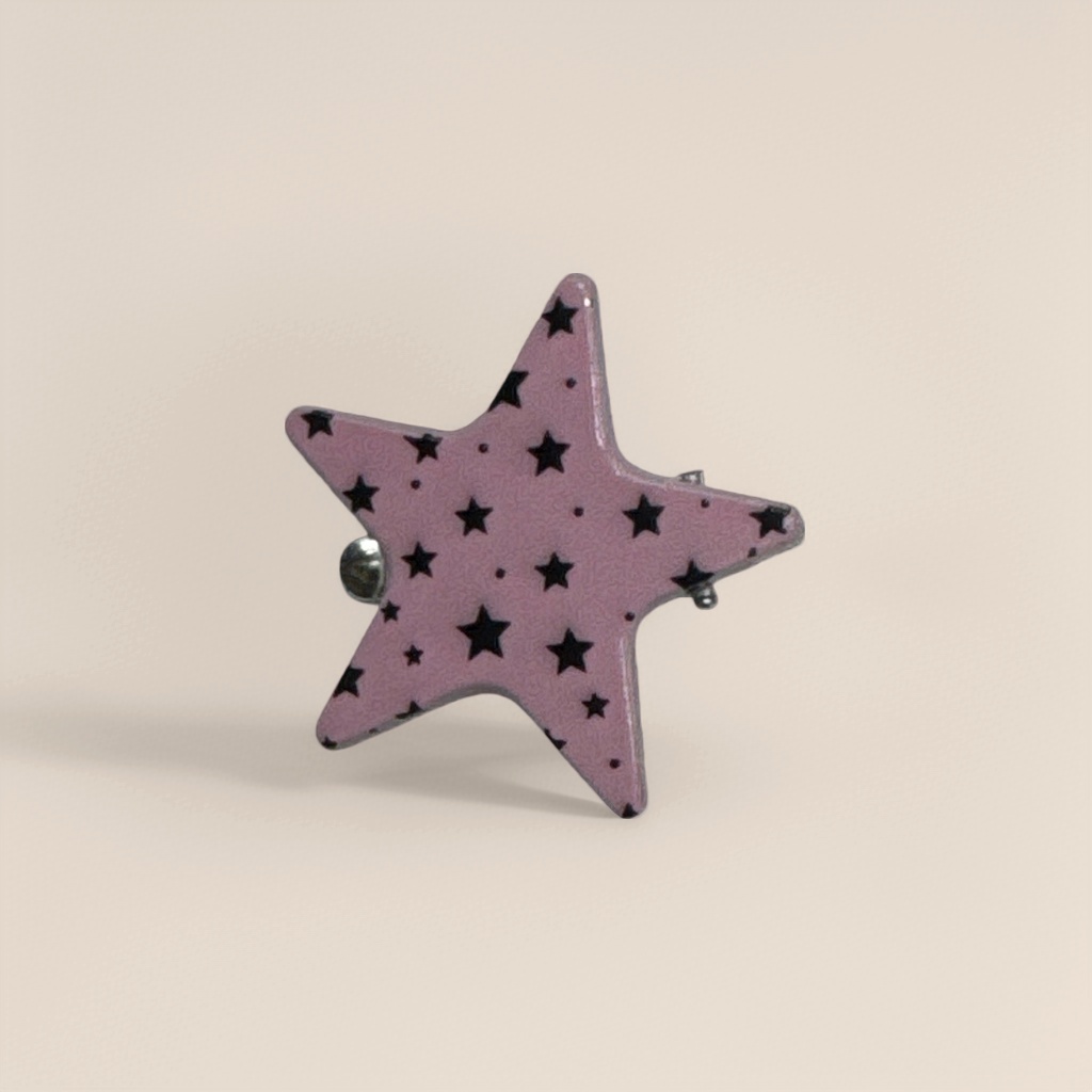 A pink star-shaped brooch is a fashionable and simple metal accessory for women's daily wear Application Scenario