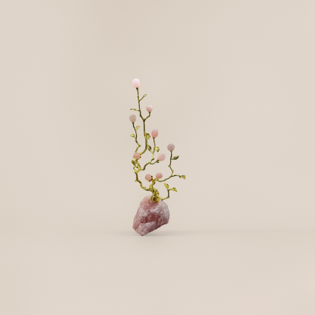 A pink gemstone ornament inlaid with golden branches and a rose quartz base details Picture