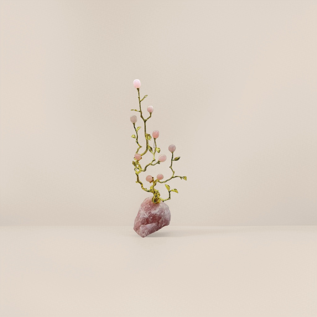 A pink gemstone ornament inlaid with golden branches and a rose quartz base Specification image