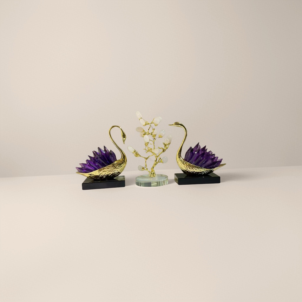 A golden swan figurine with amethyst wing-shaped crystal branch decoration