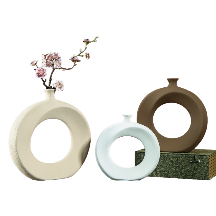 A light beige, light blue or brown circular vase with pink flowers for home decoration Item Picture