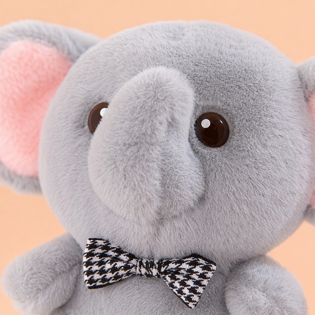 Three plush elephant figurines wearing black and white checkered bow ties for home decoration Application Scenario