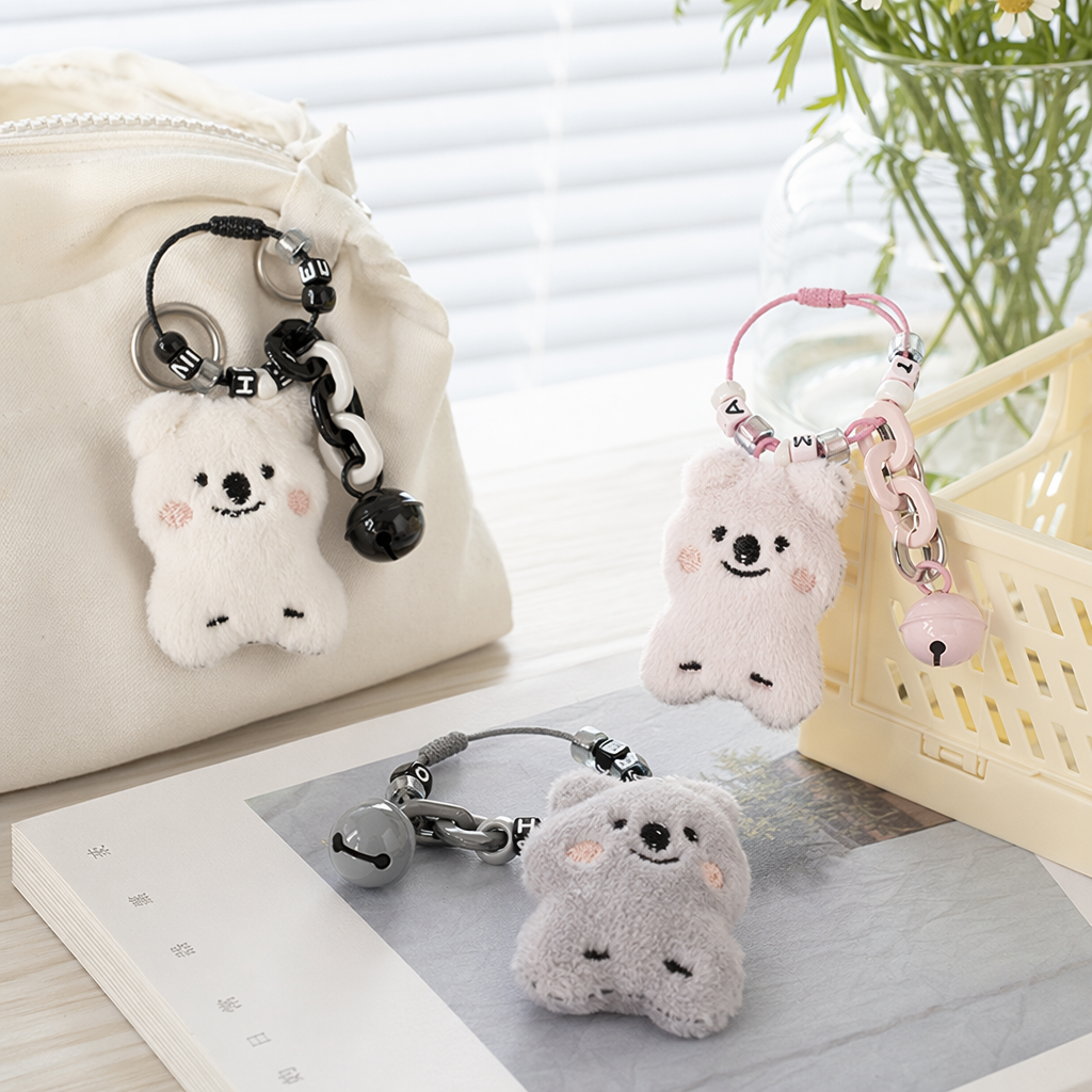 Three plush koala keychains with black, pink and grey theme decorative chains and bell keychains details Picture
