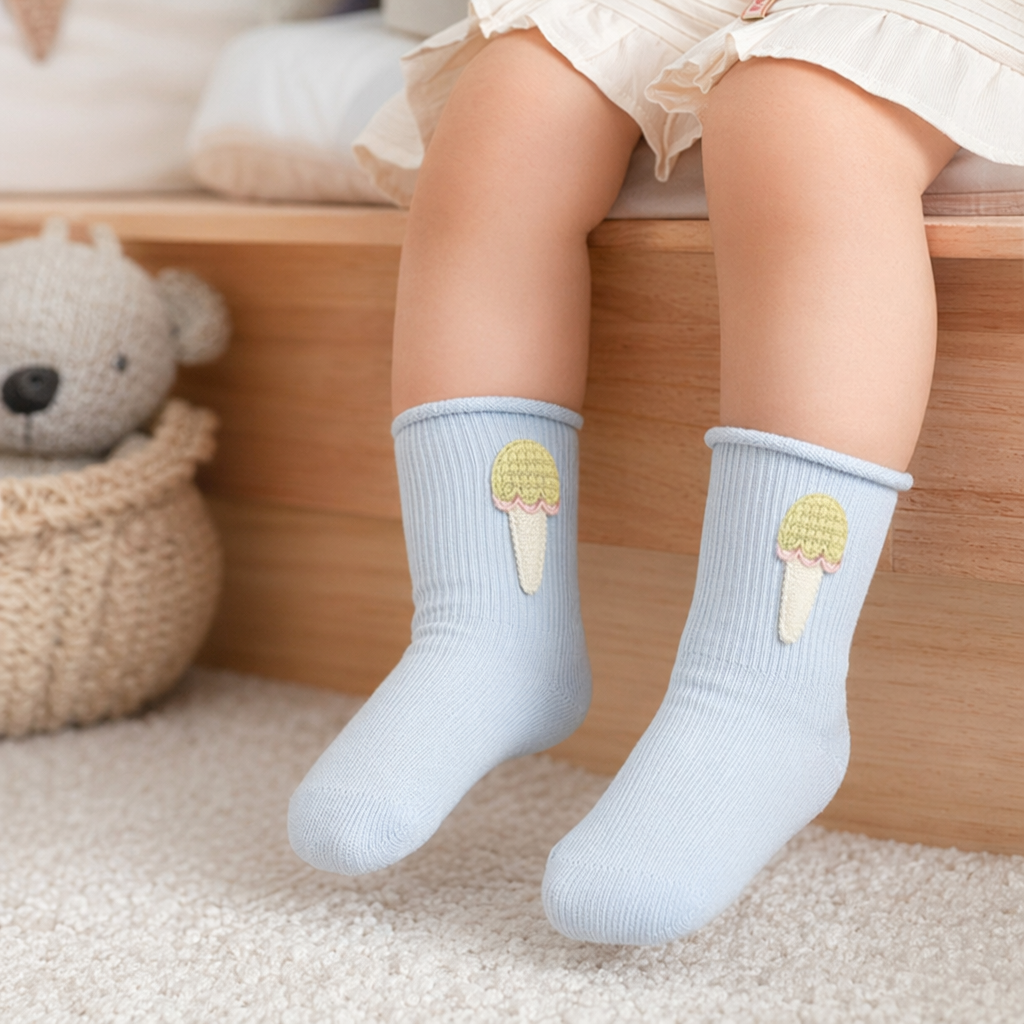 Light blue knitted socks with ice cream-shaped decorations at the top details Picture