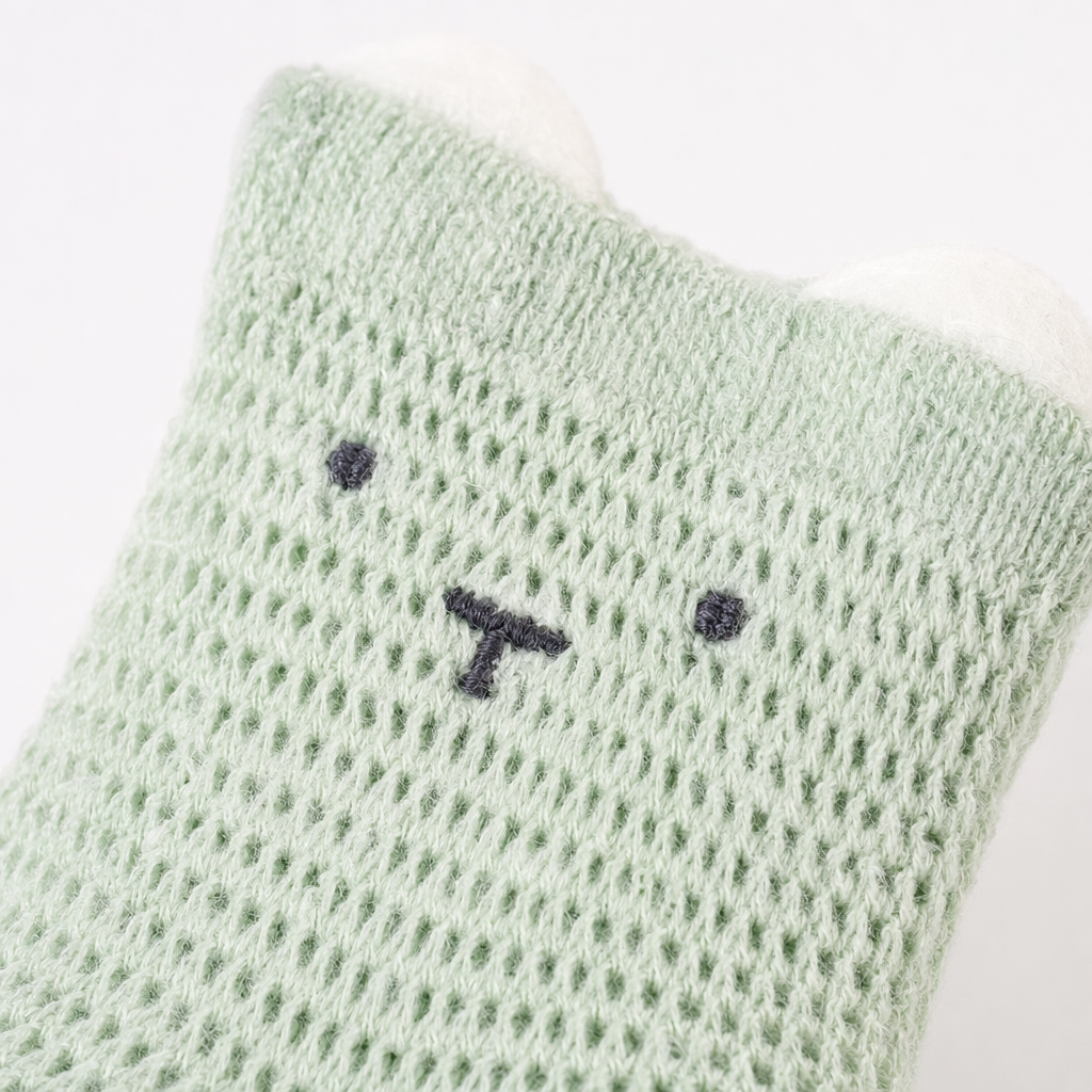 Light green knitted baby socks with ear and small face patterns, cute baby socks Application Scenario
