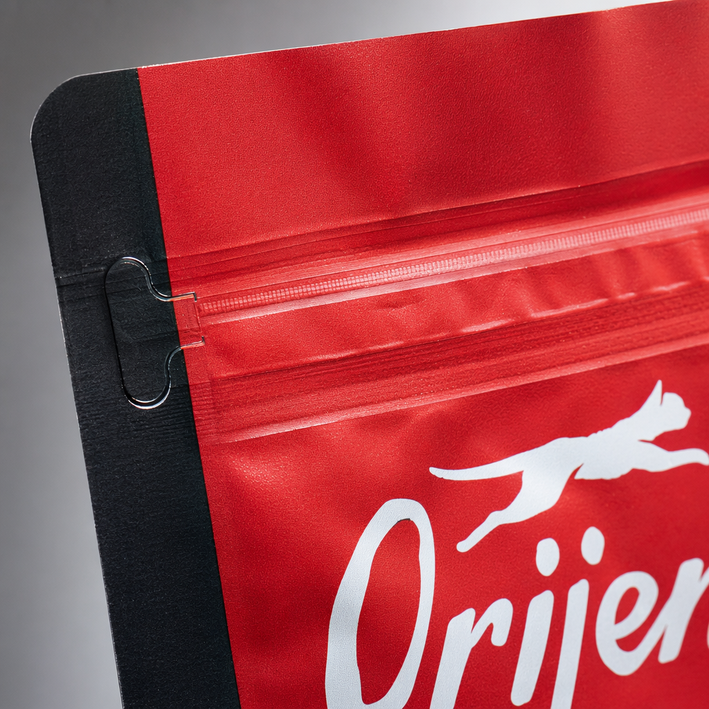 The Orange Cat Food Bag is a pet food storage bag designed for an orange cat on the grass Application Scenario