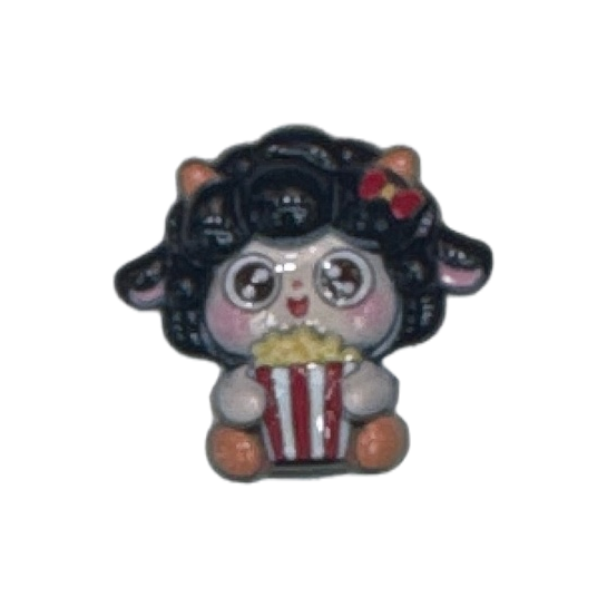 A black-haired cartoon lamb holding a red and white striped popcorn bucket plush toy Item Picture