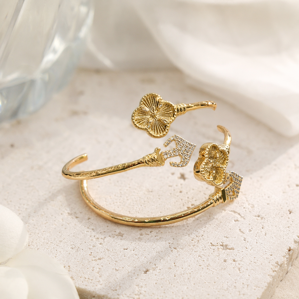 A golden four-leaf clover-decorated bracelet, packaged in a red jewelry box, is a fashionable and light luxury accessory for women details Picture