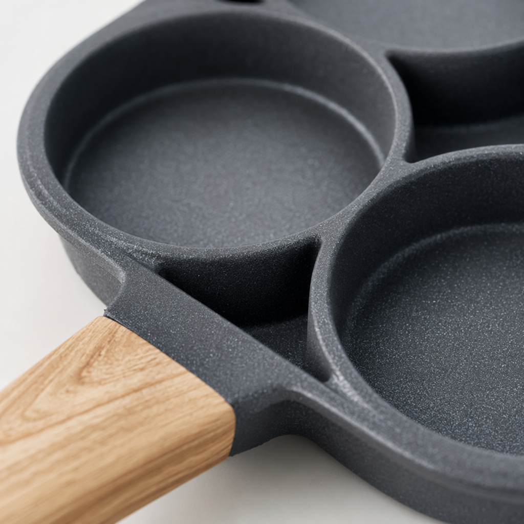 A grey five-hole frying pan with a wooden handle, non-stick, household kitchen cookware Application Scenario