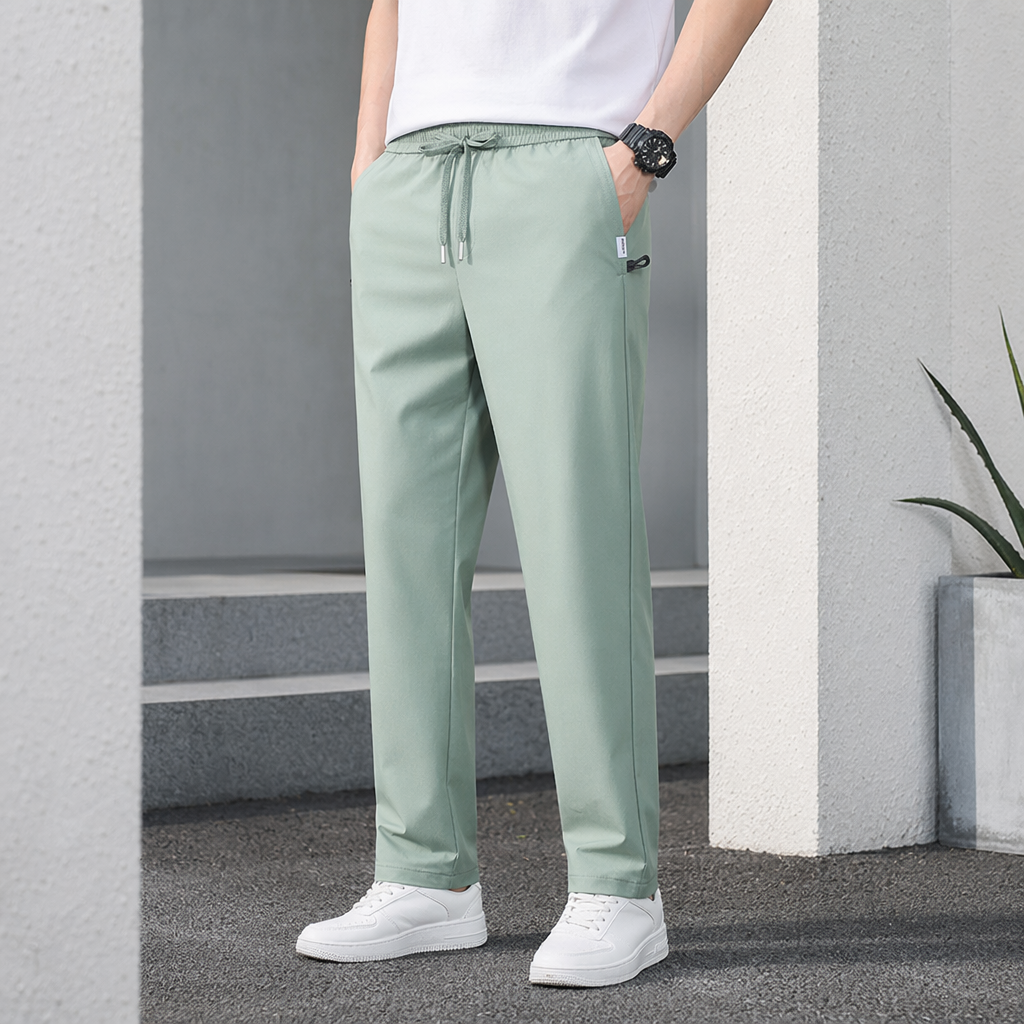 Light green casual pants for men, loose and straight-leg, are versatile for summer details Picture