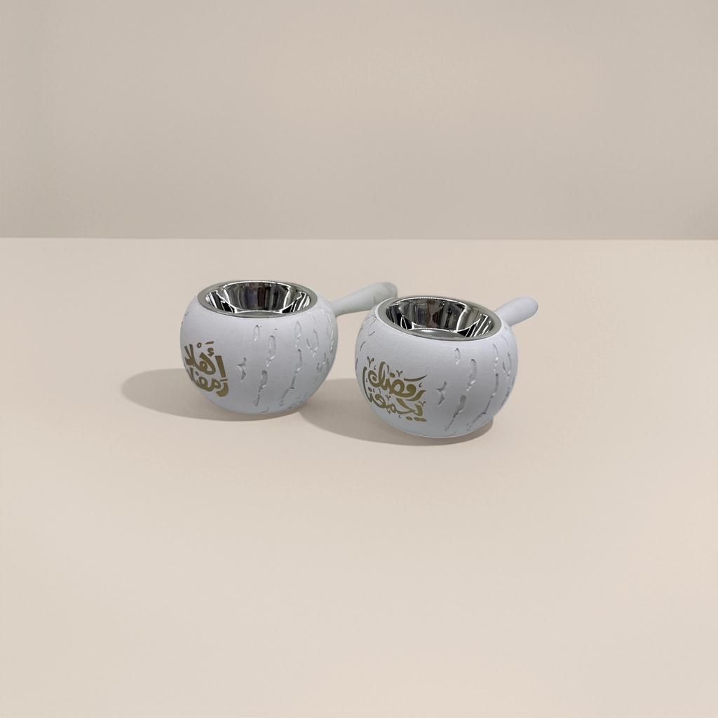 A white incense burner decorated with golden Arabic characters details Picture