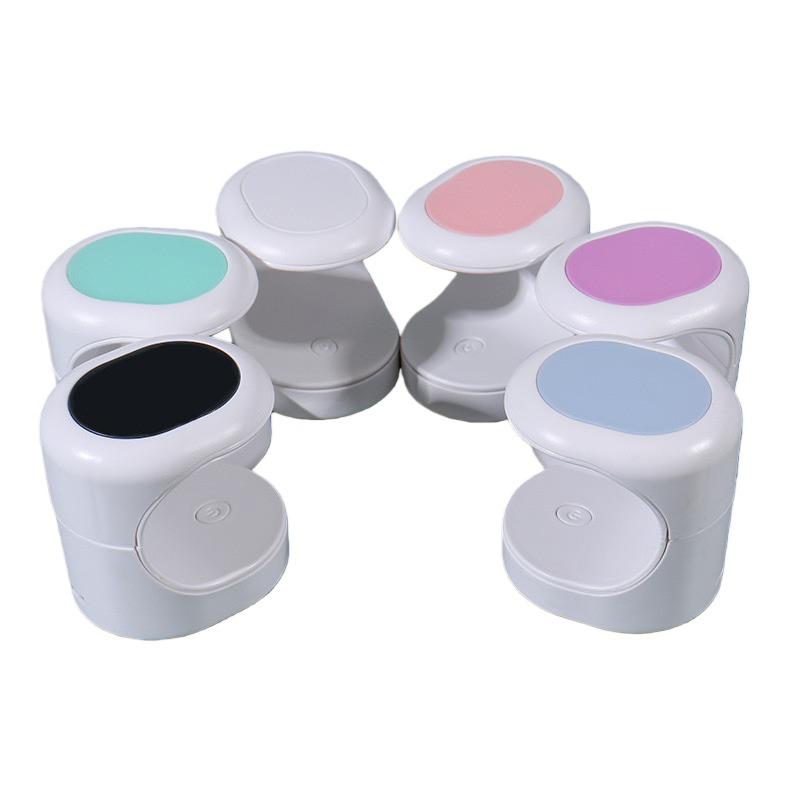 A portable small container with a white multi-color lid Item Picture