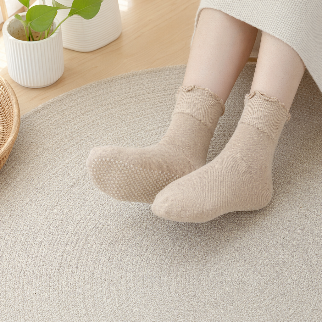 Beige anti-slip socks with white dots on the soles, raised lotus patterns, ribbed cuffs, and full lotus leaf fringes details Picture