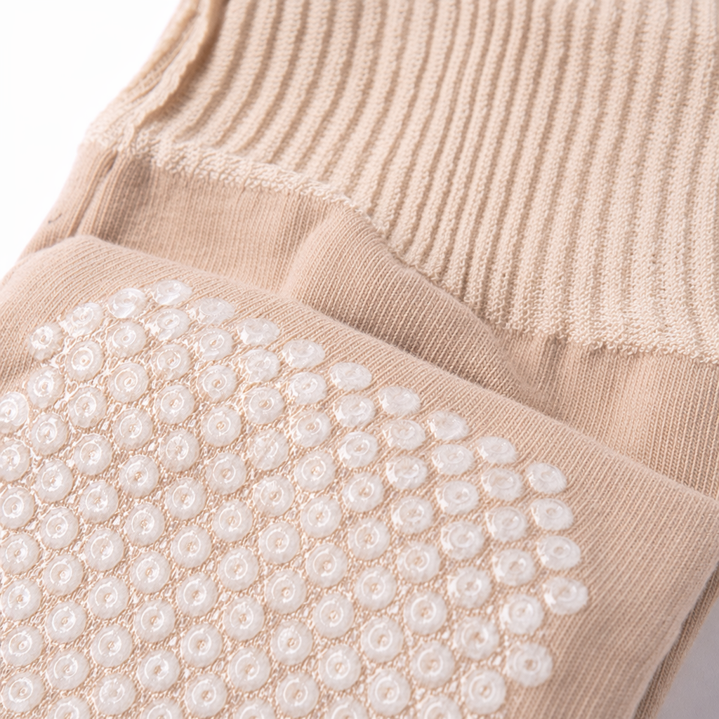 Beige massage socks with white raised dot texture on the sole, ribbed finish, lotus pattern, and full-foot lotus leaf edge socks Application Scenario