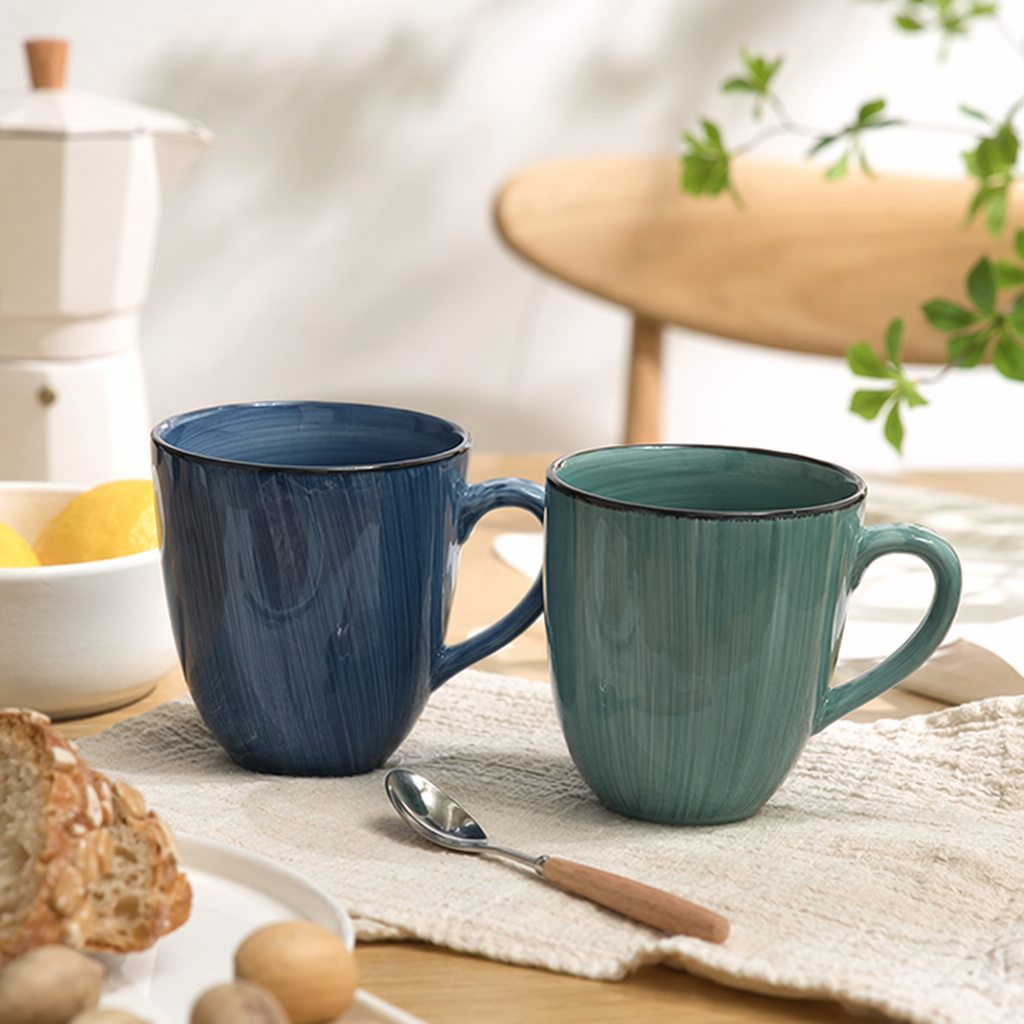 Blue striped ceramic cups and green striped ceramic cups with smooth glaze are household coffee cups details Picture