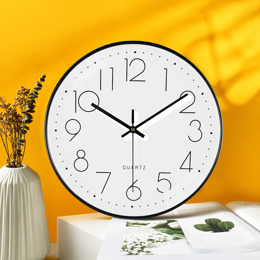 A simple wall clock with a black frame and a white dial, suitable for decoration in the living room and bedroom Specification image
