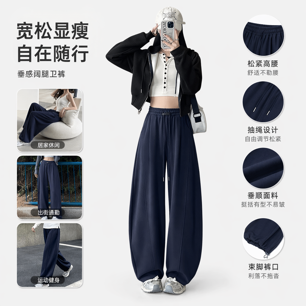A woman in navy blue wide-leg pants paired with a black hooded jacket and a white short top, the same style as the model