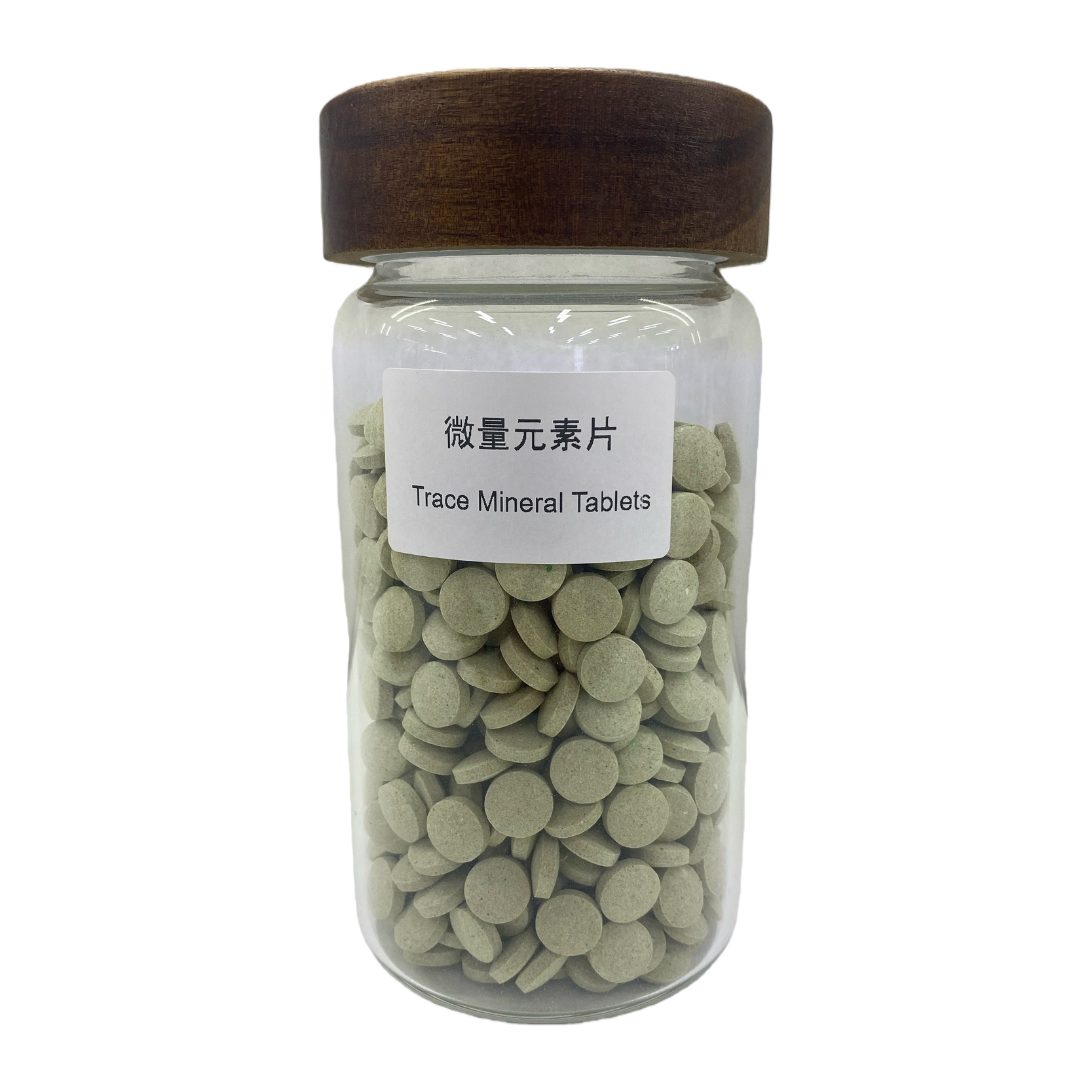 Transparent glass bottle with wooden cap containing green round Trace Mineral Tablets Item Picture